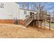 Elevated deck with stairs leading to backyard at 10414 Club Car Ct, Mint Hill, NC 28227