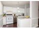 White kitchen with stainless steel appliances at 10414 Club Car Ct, Mint Hill, NC 28227