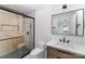 Modern bathroom with a walk-in shower and floating vanity at 110 Hubbard St, Belmont, NC 28012