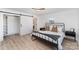 Spacious bedroom with built-in shelving and a sliding barn door at 110 Hubbard St, Belmont, NC 28012