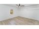 Simple bedroom with wood floors and ceiling fan at 110 Hubbard St, Belmont, NC 28012