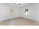 Spacious bedroom with wood floors and dual windows at 110 Hubbard St, Belmont, NC 28012