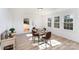 Sunlit dining area with hardwood floors and backyard access at 110 Hubbard St, Belmont, NC 28012