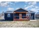 Charming house with a wooden front porch and dark-colored siding at 110 Hubbard St, Belmont, NC 28012