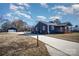 Newly renovated home with a long driveway, detached garage, and modern exterior at 110 Hubbard St, Belmont, NC 28012