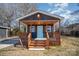 Charming dark gray bungalow with light blue door and wooden porch at 110 Hubbard St, Belmont, NC 28012