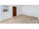 Simple interior room with wood-look flooring and new door at 110 Hubbard St, Belmont, NC 28012