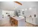 Open kitchen with white cabinets and a large island at 110 Hubbard St, Belmont, NC 28012