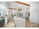 Modern kitchen with white cabinets and an island at 110 Hubbard St, Belmont, NC 28012