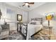 Bright bedroom featuring a metal bed frame and window shutters at 1101 Churchill Downs Dr, Waxhaw, NC 28173