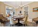 Formal dining room with seating for six and chandelier at 1101 Churchill Downs Dr, Waxhaw, NC 28173