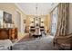 Bright dining room with a round table and large windows at 1101 Churchill Downs Dr, Waxhaw, NC 28173