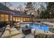 Relaxing pool and spa with patio seating at dusk at 1101 Churchill Downs Dr, Waxhaw, NC 28173