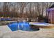 Stunning pool and spa with water features at night at 1101 Churchill Downs Dr, Waxhaw, NC 28173