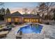 Inviting backyard oasis with a pool and spa at 1101 Churchill Downs Dr, Waxhaw, NC 28173