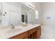 Bathroom with double vanity, bathtub, and shower at 11104 Fox Cove Dr, Charlotte, NC 28273