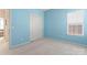 Light blue bedroom with closet and view of another room at 11104 Fox Cove Dr, Charlotte, NC 28273