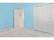 Light blue bedroom with double doors and carpet at 11104 Fox Cove Dr, Charlotte, NC 28273