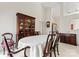 Formal dining room with an oval table and china cabinet at 11104 Fox Cove Dr, Charlotte, NC 28273