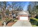 Brick ranch home with attached garage and landscaping at 11104 Fox Cove Dr, Charlotte, NC 28273