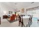 Bright living room features a dining area, fireplace, and access to a patio at 11104 Fox Cove Dr, Charlotte, NC 28273