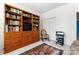 Home office with bookcase, tv, and rocking chair at 11104 Fox Cove Dr, Charlotte, NC 28273