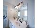 Bright bathroom featuring dual sinks, a modern vanity, and sleek black hardware at 1120 Spicewood Pines Rd, Fort Mill, SC 29708