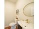 Well-lit half bathroom featuring a modern sink, stylish mirror, and neutral decor at 1120 Spicewood Pines Rd, Fort Mill, SC 29708