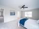 Bright primary bedroom featuring a plush bed, ample natural light, and a ceiling fan at 1120 Spicewood Pines Rd, Fort Mill, SC 29708