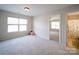 Carpeted bedroom showcasing natural light, neutral walls, and an en-suite bathroom at 1120 Spicewood Pines Rd, Fort Mill, SC 29708