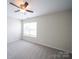 Spacious bedroom with neutral carpeting and a large window at 1120 Spicewood Pines Rd, Fort Mill, SC 29708