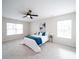 Spacious bedroom with a plush bed, ample natural light, and a ceiling fan at 1120 Spicewood Pines Rd, Fort Mill, SC 29708