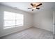 Cozy bedroom with a ceiling fan and a window, showcasing a simple and peaceful retreat at 1120 Spicewood Pines Rd, Fort Mill, SC 29708