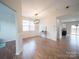 Bright dining room featuring modern chandelier, wood floors, wainscoting, and ample natural light at 1120 Spicewood Pines Rd, Fort Mill, SC 29708