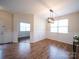 Inviting dining room featuring wood floors, wainscoting, and a modern chandelier at 1120 Spicewood Pines Rd, Fort Mill, SC 29708