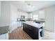 Modern kitchen with white cabinets, marble island, and stainless steel appliances at 1120 Spicewood Pines Rd, Fort Mill, SC 29708