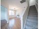 Bright and airy entryway with hardwood floors and staircase at 1120 Spicewood Pines Rd, Fort Mill, SC 29708