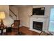 Living room with fireplace, hardwood floors, and stairs at 113 Rocky Trail Ct, Fort Mill, SC 29715