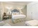 Cozy bedroom with a beautifully decorated bed, complemented by elegant side tables and decor at 1136 Bolling Rd, Charlotte, NC 28207