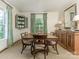 Classic dining room featuring a large table, elegant sideboard, and ample natural light at 1136 Bolling Rd, Charlotte, NC 28207