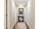 Hallway with striped wall covering, hardwood flooring, and elegant decor at 1136 Bolling Rd, Charlotte, NC 28207