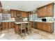 Spacious kitchen with custom cabinets, an island with barstool seating, and modern appliances at 1136 Bolling Rd, Charlotte, NC 28207