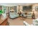 Comfortable living room with a full bookshelf, soft sofas, and sophisticated decor at 1136 Bolling Rd, Charlotte, NC 28207