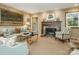 Inviting living room with a classic fireplace, plush seating, and elegant decor at 1136 Bolling Rd, Charlotte, NC 28207