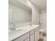 Bathroom featuring double sink vanity, large mirror, and a shower at 1175 Blackburn Cir, Edgemoor, SC 29712