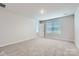 Neutral bedroom featuring carpet flooring, a large window, and a closet at 1175 Blackburn Cir, Edgemoor, SC 29712