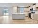 Open-concept kitchen with white cabinetry, stainless steel appliances, a center island, and wood flooring at 1175 Blackburn Cir, Edgemoor, SC 29712