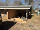 Covered carport with storage and access to the house at 1191 Carolyn Dr, Albemarle, NC 28001