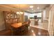 Kitchen and dining room with hardwood floors and an island at 12111 Frogs Leap Ct, Charlotte, NC 28277