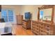 Main bedroom with hardwood floors and large windows at 12111 Frogs Leap Ct, Charlotte, NC 28277